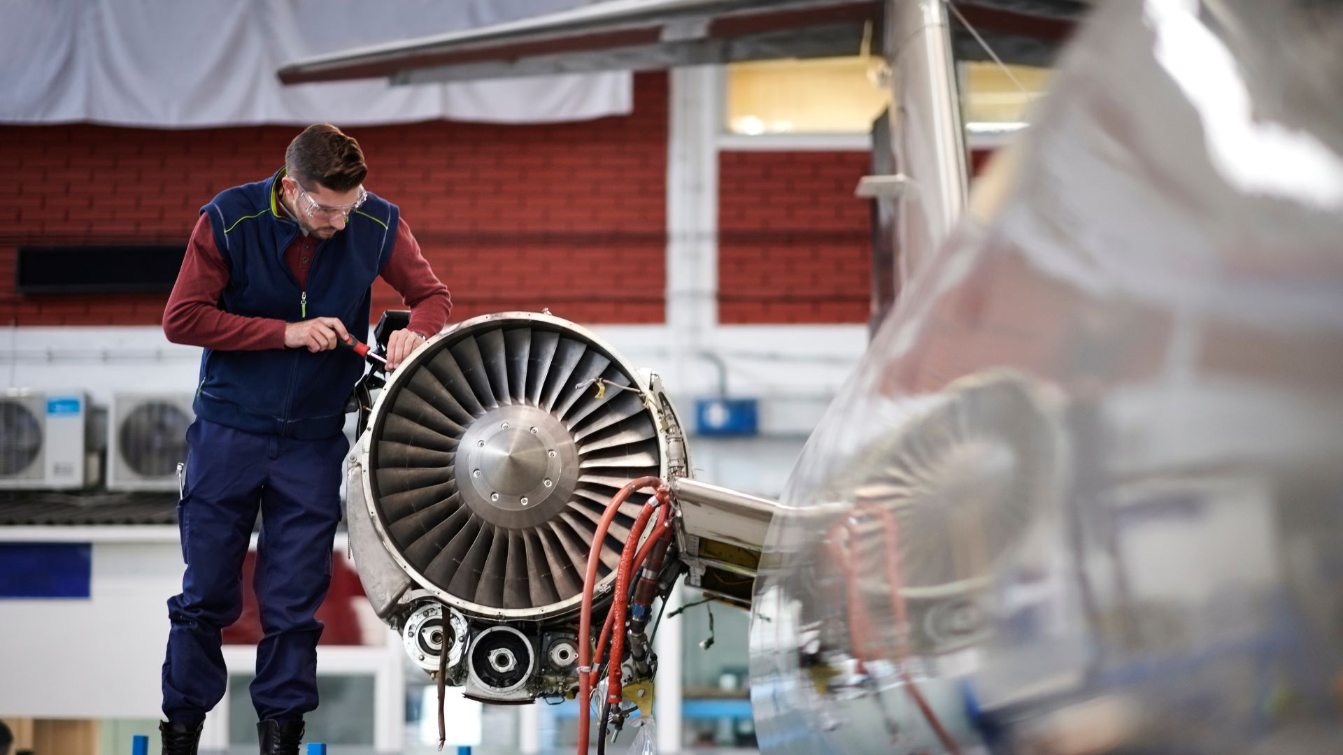 Aircraft mechanic in the hangar Aircraft mechanic in the hangar