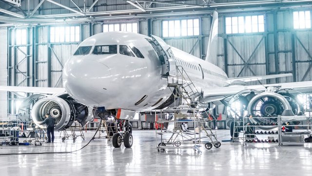 Panoramic View of Aerospace Hangar with Planes